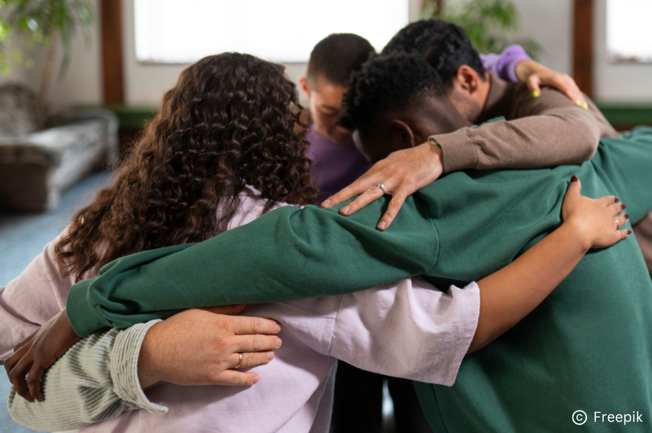 Group of people hugging